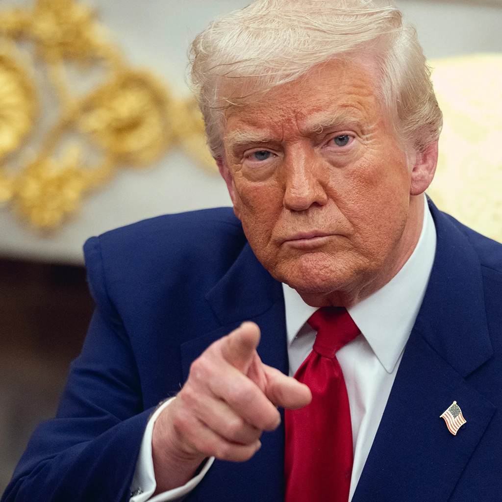 Donald Trump pointing a giner at the camera